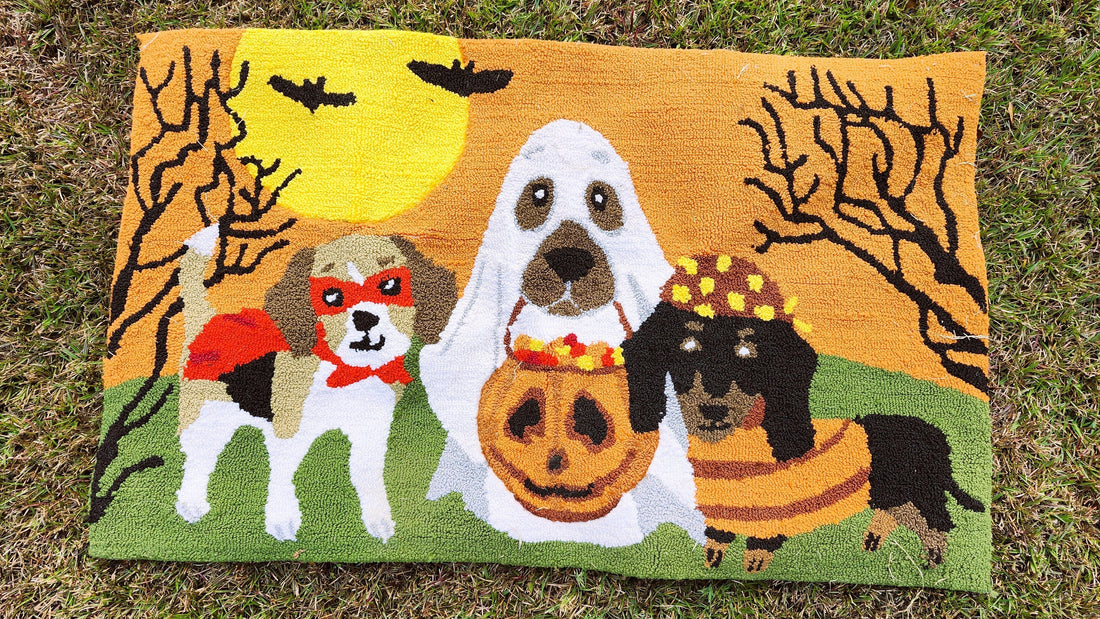 Halloween Pet Rug featuring colors of orange, green, white, and black. 